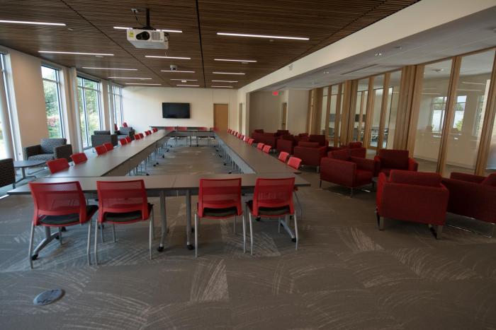 Comfortable seating with conference room tables, LCD projector, and Flat Screen TV.
