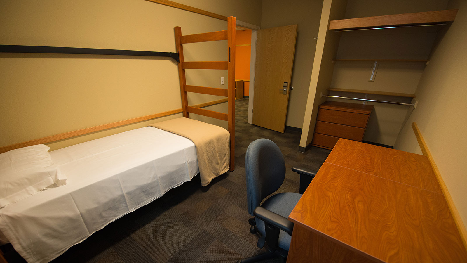 Single bed dorm room.