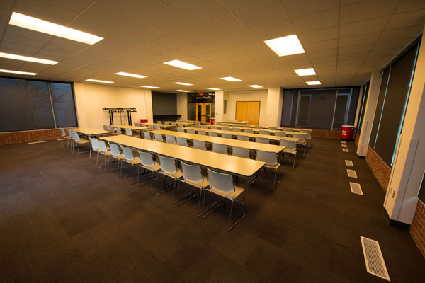 Large room with round conference table.
