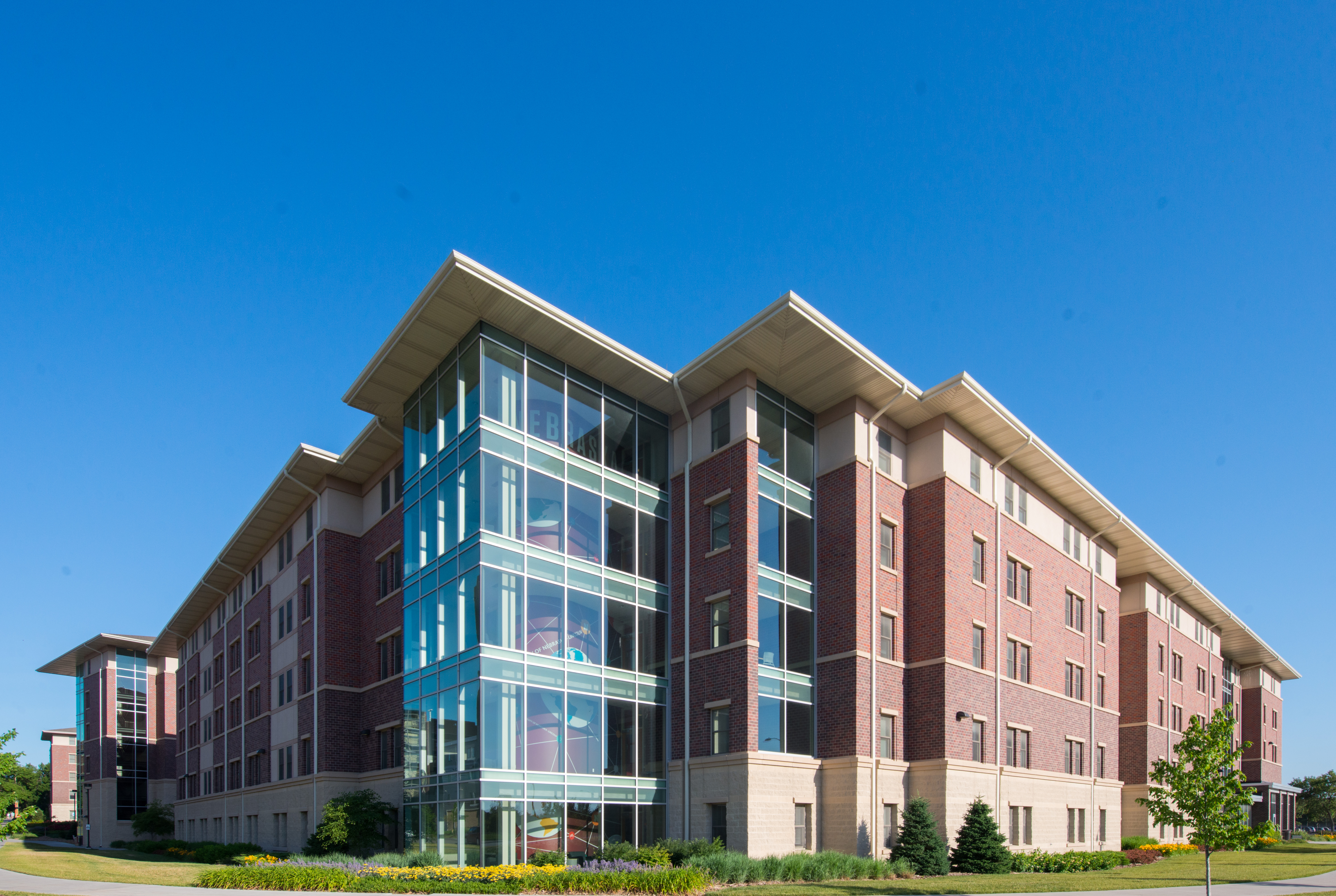 Eastside Suites exterior of building in summer light.