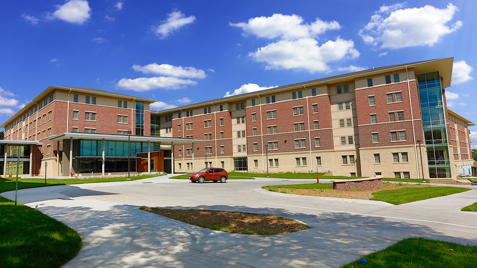 University Suites exterior of building in summer light.